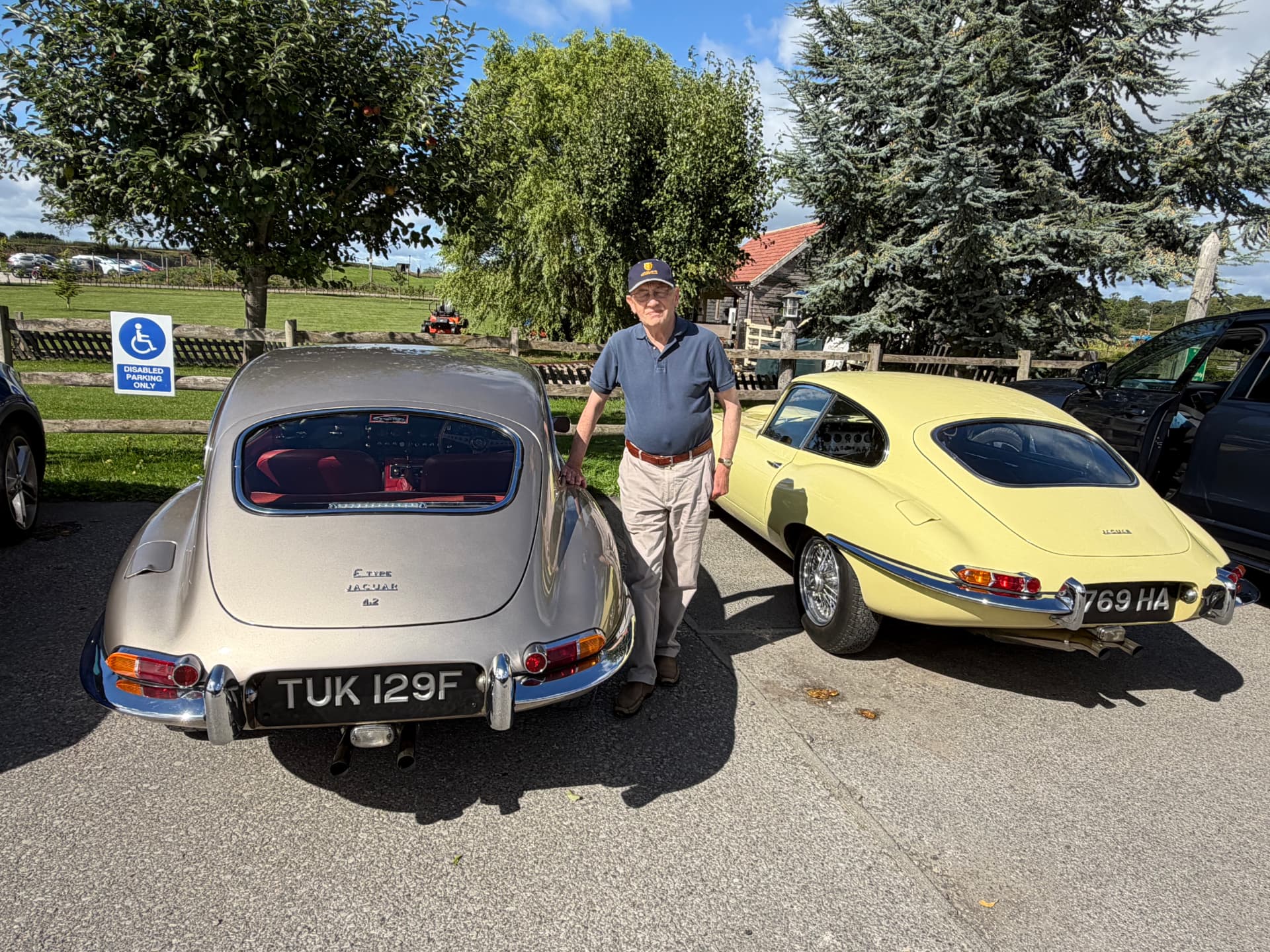 Stephen with his champagne gold Jaguar E-Type Series 1 4.2 2+2, TUK 129F, beside the Primrose 3.8 at Cedar Barn