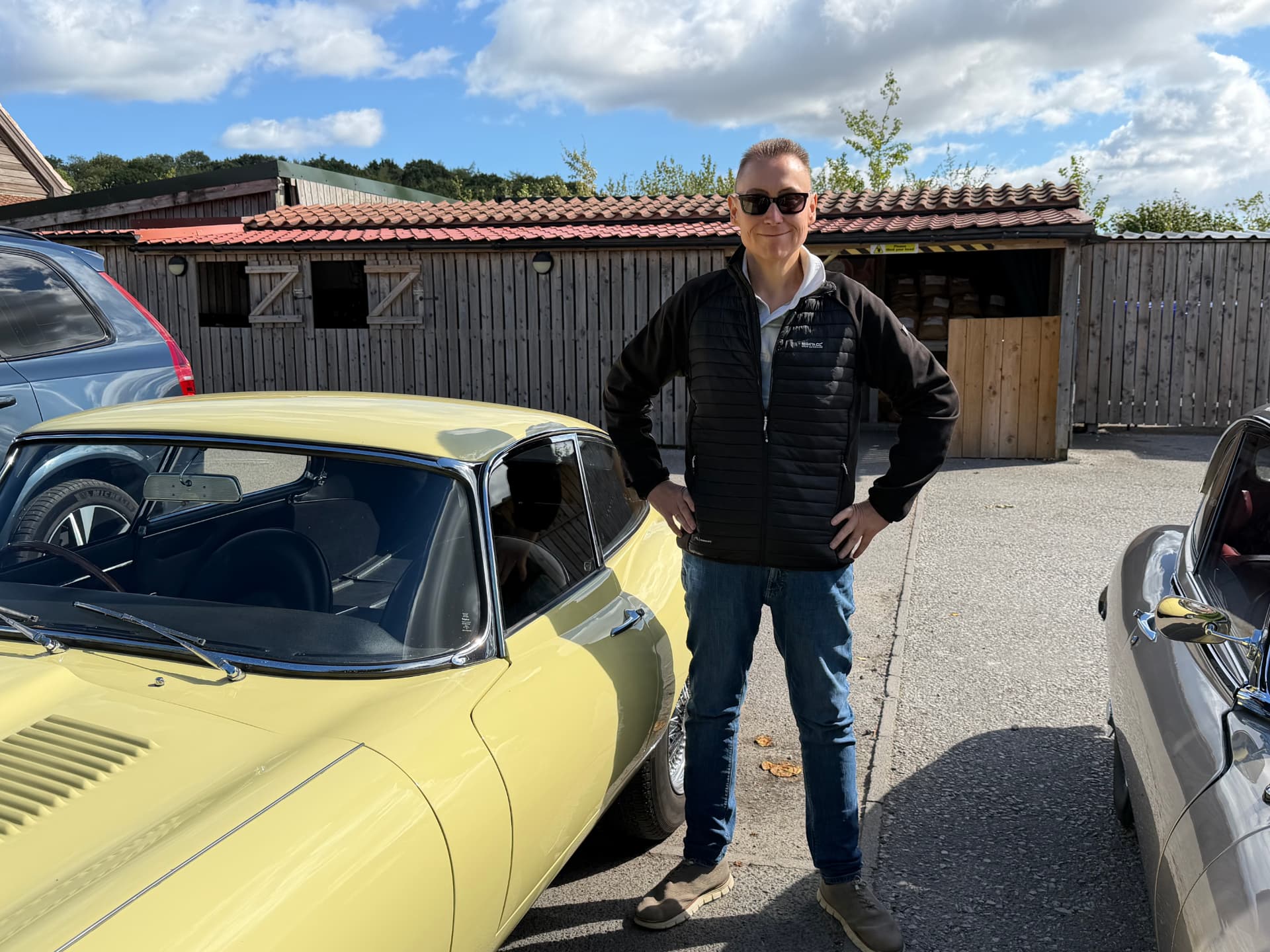Jon Cosson with his Primrose 1963 Jaguar E-Type Series 1 3.8 fixed-head coupe at Cedar Barn near Pickering