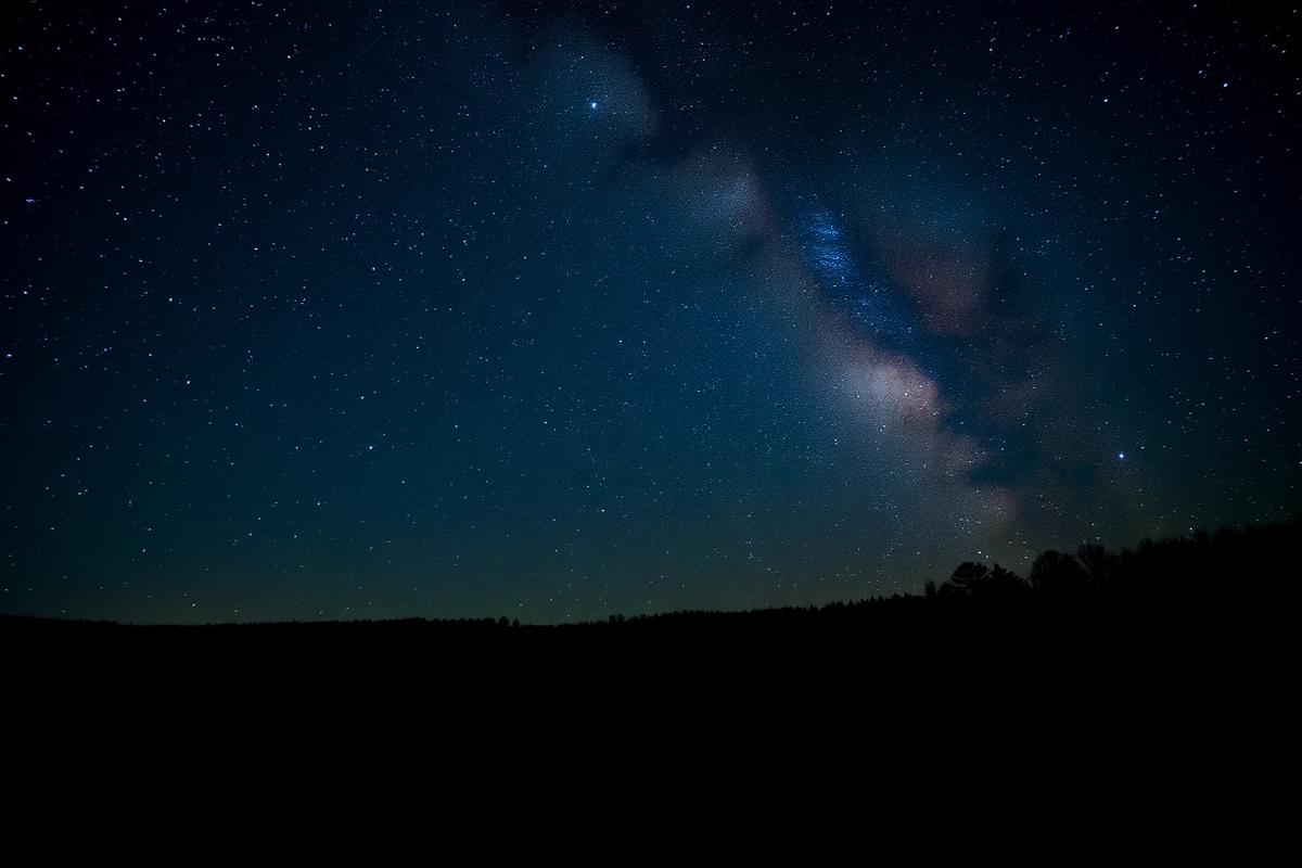 Night sky full of stars above dark moorland during the North York Moors dark skies season