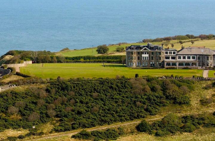Raven Hall and its grounds on the clifftop at Ravenscar above the North Sea