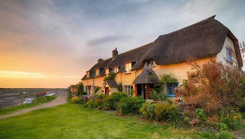 Stone cottages with pantile roofs beside the beck in Thornton-le-Dale, a popular base village in the North York Moors